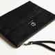 Image for article titled A Sturdy Black Clutch That Holds Almost Anything